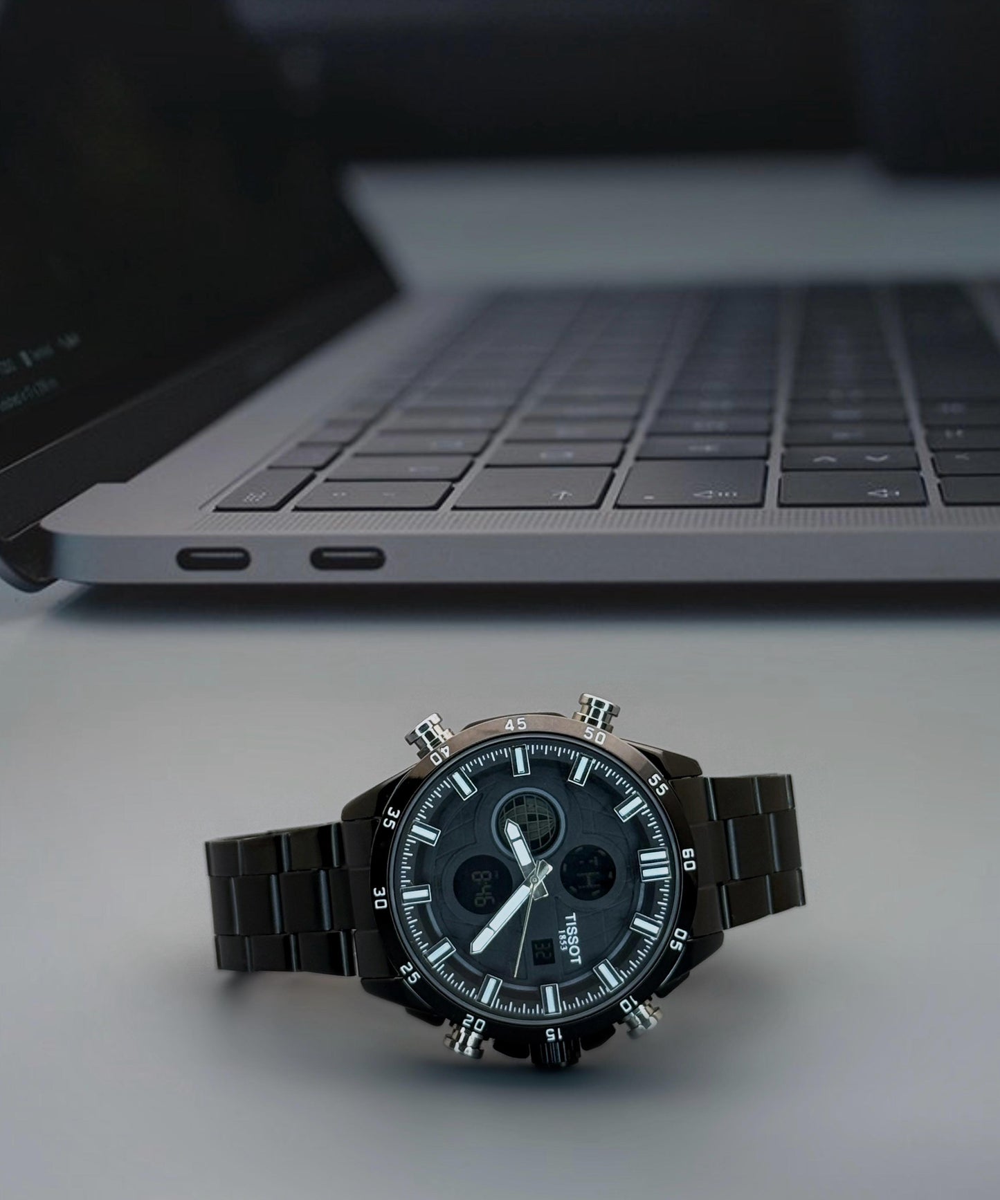 Digital and Analog watch with quartz movement and stainless steel strap.