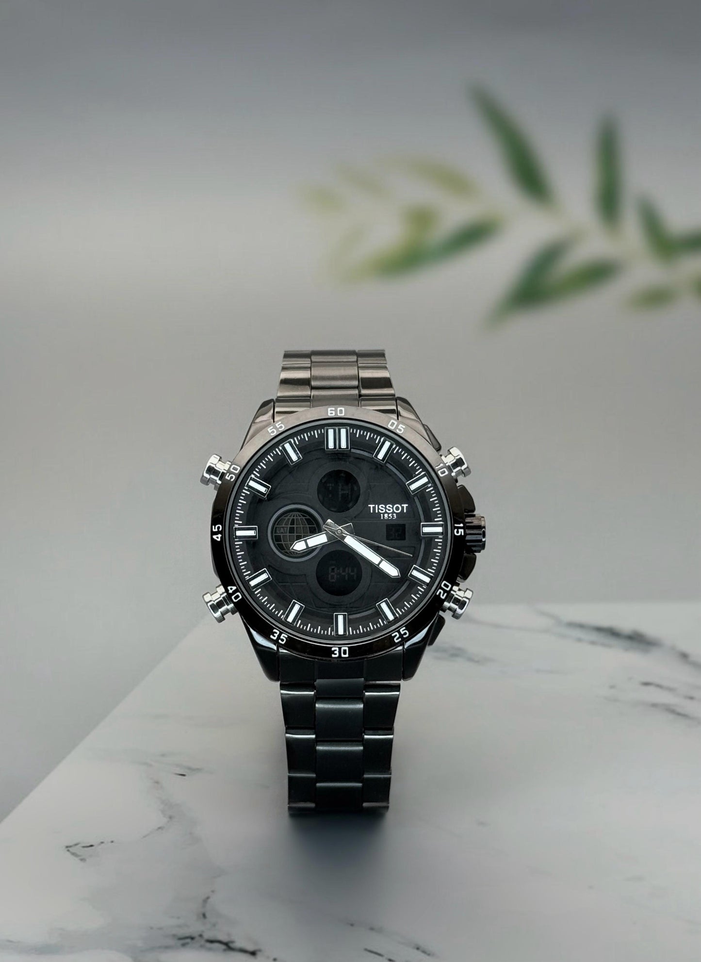 Digital and Analog watch with quartz movement and stainless steel strap.