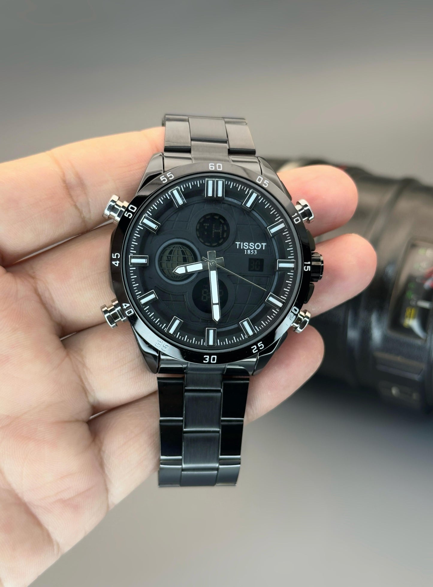 Digital and Analog watch with quartz movement and stainless steel strap.