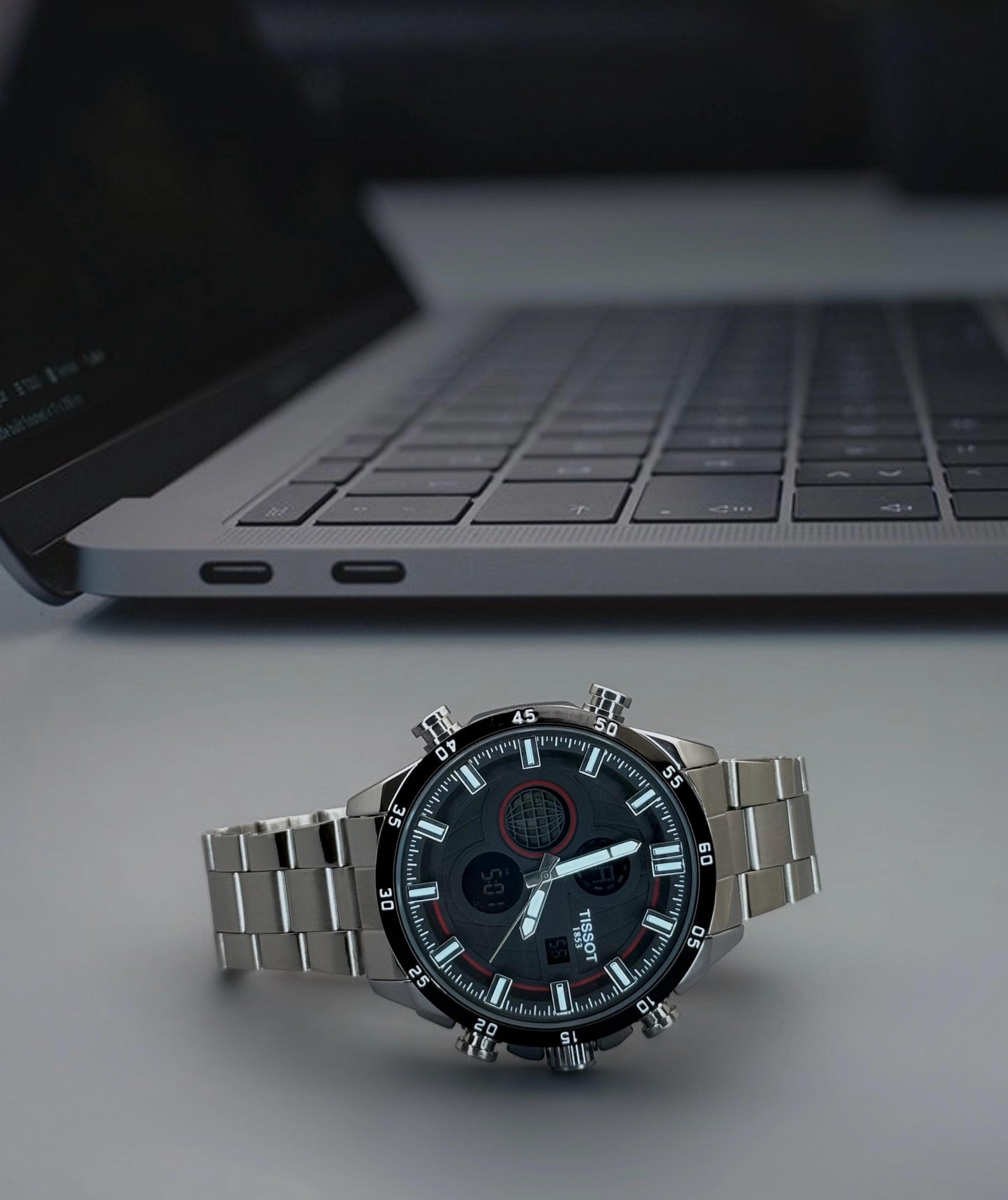 Digital and Analog watch with quartz movement and stainless steel strap.