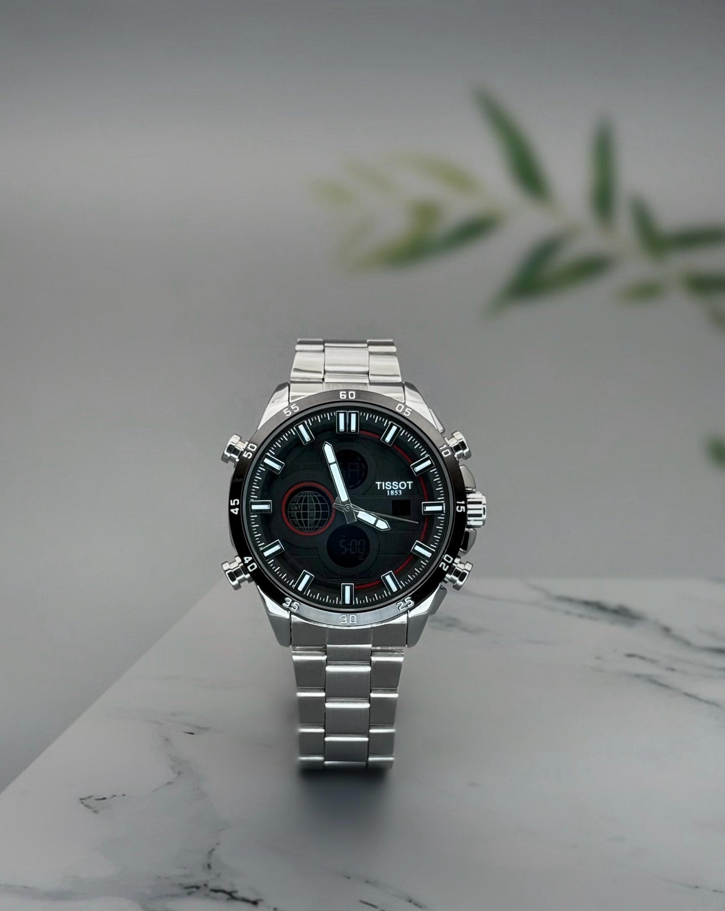 Digital and Analog watch with quartz movement and stainless steel strap.